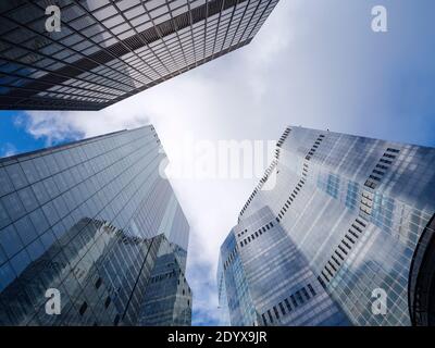 A dramatic view of three commercial skyscrapers seen from Undershaft in the City of London, 22 Bishopsgate, the St Helen's and Leadenhall Buildings Stock Photo