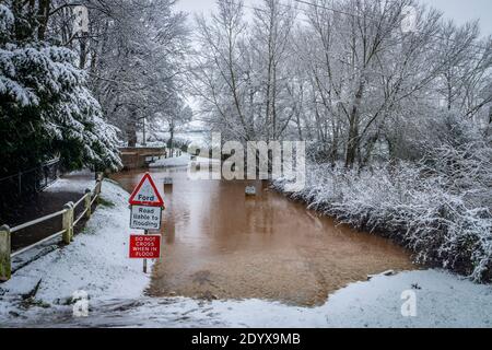 Snow and floodwater in ford near Kempsey, Worcester, December 2020 Stock Photo