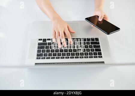Woman working on laptop Stock Photo