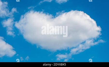 A heart-shaped cloud against the blue sky Stock Photo