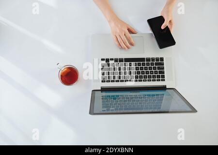 Woman working on laptop Stock Photo