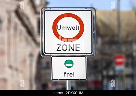 Road traffic sign marking a low emission zone in city centers in Germany translating as 'Environmental Zone' Stock Photo