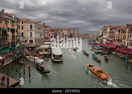 Venice, Italy - June 22, 2014: The view of boat traffic using the Grand Canal, which is the main waterway of Venice that divides the city in two, on a Stock Photo