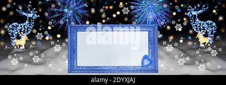 Snowy landscape with text frame, fireworks, bokeh in the form of deer. Widescreen defocused background, art design Stock Photo