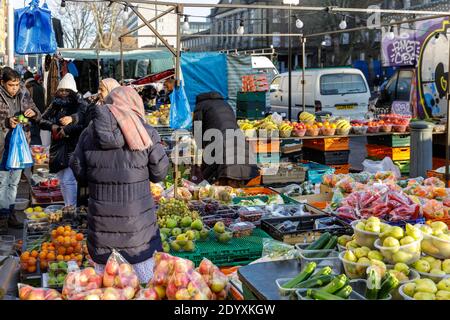 Whitechapel Market, outdoor daily fruit  and vegetable market stall, people food  shopping, Tower Hamlets, East London, England Stock Photo