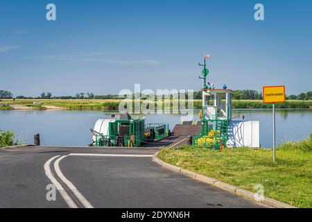 Small, vintage paddle steamer ferry operating on Oder River crossing between Poland and Germany, near Gozdowice village Stock Photo