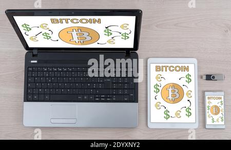 Bitcoin concept shown on different information technology devices Stock Photo