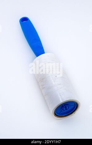 roller for cleaning clothes from wool, pet hair on clothes, Roller cleans clothes Stock Photo