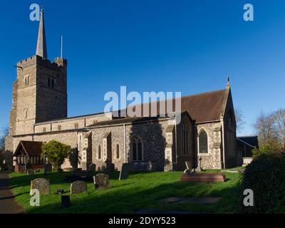 13th Century St. John the Baptist Church, Aldenham, UK. Stone built church with Tenor Bell Tower, Serene graveyard. Public walkways through to woods Stock Photo