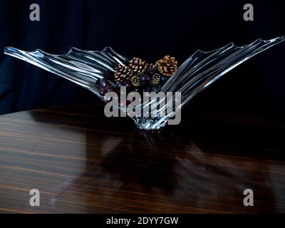 Study in Still Life of 1950's rippled and winged glass fruit bowl or vase. Interior Design Ornament. Study in natural reflective lighting. Stock Photo