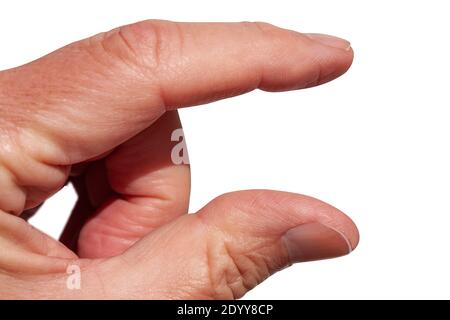 Hand's index finger and thumb measuring invisible item. Isolated on white. Close up image. Stock Photo