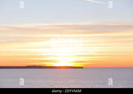 Background of beautiful winter sunset in the Adriatic coast against the blue Adriatic sea in Slovenia. Stock Photo
