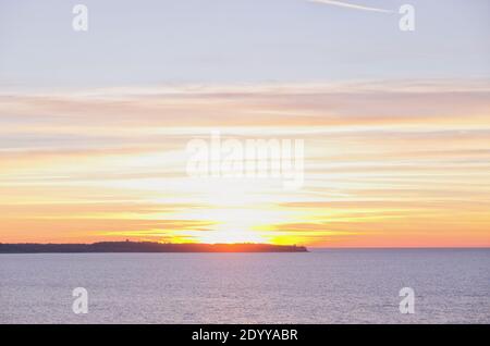 Background of beautiful winter sunset in the Adriatic coast against the blue Adriatic sea in Slovenia. Stock Photo