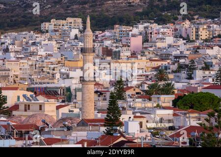 Cityscape view of Rethymno at twilight showing the minaret of Neratze Mosque, as seen from Fortezza Castle, Crete, Greece Stock Photo