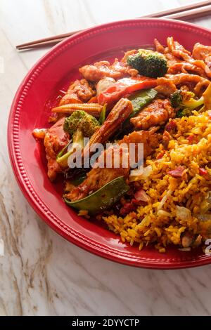 Szechuan stir fried chicken with chinese vegetables and pork fried rice Stock Photo