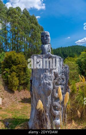 Maori sculpture at Wairakei Terraces in New Zealand Stock Photo