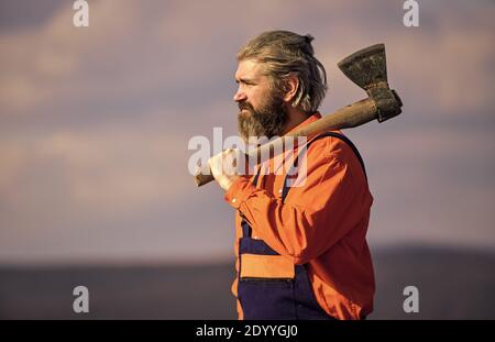 lets start working. Skilled architect repair and fix. engineer career. bearded man in uniform. mature man builder use axe. professional repairman working with ax tool. build and construction. Stock Photo
