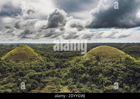 Chocolate Hills with a group of clouds in the sky Stock Photo