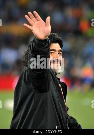 (201228) -- BEIJING, Dec. 28, 2020 (Xinhua) -- Argentine coach Diego Maradona waves to the crowd before the 2010 World Cup Group B soccer match between Argentina and Greece in Polokwane, South Africa, June 22, 2010. On January 26, retired NBA mega Kobe Bryant was killed in a helicopter crash above Calabasas, southern California. The only team he had played for throughout his NBA career, the Los Angeles Lakers, beat the Miami Heat in the Finals to win a record-equaling 17th NBA champions on October 11. On November 25, Argentine football legend Diego Maradona died of a heart attack at his home, Stock Photo