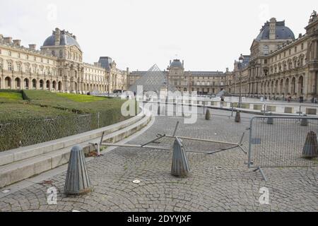 Paris, France. 28th Dec, 2020. A general view on almost deserted Napoleon courtyard near the closed Louvre museum amid the coronavirus pandemic on December 28, 2020 in Paris, France. According the latest report of the French National Authority for Health (HAS) 175 people died in hospital, and 8,822 new cases of Covid-19 infection, strict measures are still in place as curfew from 8:00 p.m. to 6:00 a.m. was put in place in all territory French. (Photo by Paulo Amorim/Sipa USA) Credit: Sipa USA/Alamy Live News Stock Photo