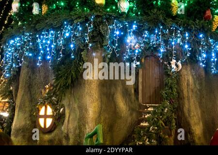 Magic gnome house in a tree trunk. Stock Photo