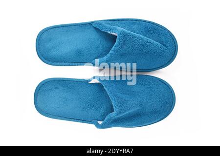 Soft blue home guest slippers isolated on white background Stock Photo