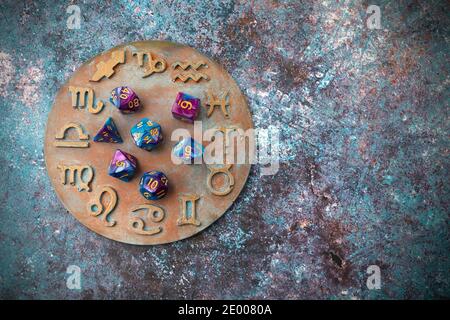 Horoscope circle with divination dice. Fortune telling and astrology predictions. Stock Photo