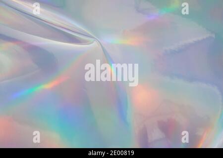 Rainbow halographic wrinkled foil background. Abstract pastel color background. Stock Photo
