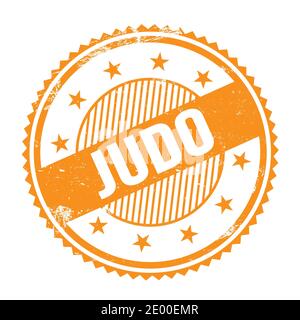 JUDO text written on orange grungy zig zag borders round stamp. Stock Photo