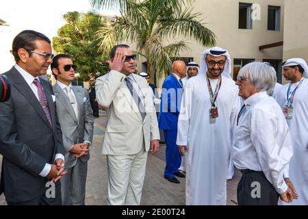 Morocco's King Mohammed VI (2nd from L) seen with Bernie Ecclestone (1st from R) and Abu Dhabi's Crown Prince Sheikh Mohammed Bin Zayed Al Nahyan (2nd from R) at Yas Marina Circuit, near Abu Dhabi, United Arab Emirates, on November 3rd, 2013, during 5th Abu Dhabi Formula One Grand Prix. Photo by Ammar Abd Rabbo/ABACAPRESS.COM Stock Photo