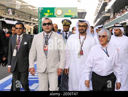 Morocco's King Mohammed VI (2nd from L) seen with Bernie Ecclestone (1st from R) and Abu Dhabi's Crown Prince Sheikh Mohammed Bin Zayed Al Nahyan (2nd from R) at Yas Marina Circuit, near Abu Dhabi, United Arab Emirates, on November 3rd, 2013, during 5th Abu Dhabi Formula One Grand Prix. Photo by Balkis Press/ABACAPRESS.COM Stock Photo