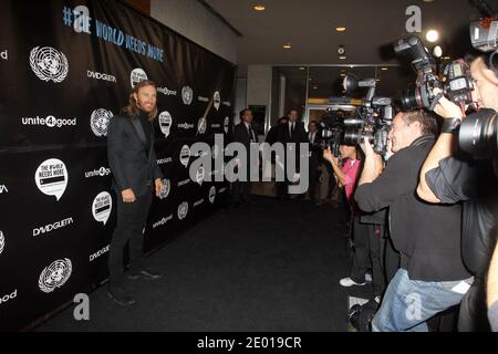 French DJ David Guetta attends the premiere of David Guetta's new music video 'One Voice' onto the front of United Nations headquarters in New York City, NY, USA, on November 22, 2013. Photo by Charles Guerin/ABACAPRESS.COM. Stock Photo