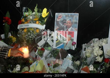 French people pay tribute to Nelson Mandela in front of South African embassy in Paris, France on December 6, 2013. Photo by Alain Apaydin/ABACAPRESS.COM Stock Photo