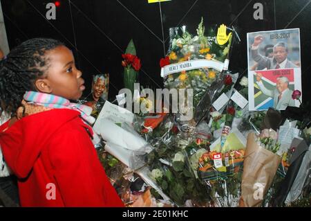 French people pay tribute to Nelson Mandela in front of South African embassy in Paris, France on December 6, 2013. Photo by Alain Apaydin/ABACAPRESS.COM Stock Photo