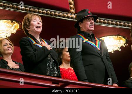 Kennedy Center Honorees Carlos Santana, left, and Shirley MacLaine, right, attend the 2013 Kennedy Center Honors in Washington, DC, USA on December 8, 2013. The honorees this year include: opera singer Martina Arroyo, jazz musician Herbie Hancock, musician Billy Joel, actress Shirley MacLaine and musician Carlos Santana. Photo by Kristoffer Tripplaar/Pool/ABACAPRESS.COM Stock Photo