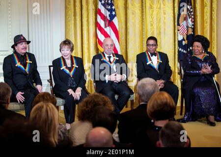 2013 Kennedy Center Honorees (L-R) Carlos Santana, Shirley MacLaine, Billy Joel, Herbie Hancock and Martina Arroyo attend a reception at the White House prior to the Kennedy Center ceremony on December 8, 2013 in Washington, DC. Photo Credit: Kristoffer Tripplaar/ Sipa Press Stock Photo