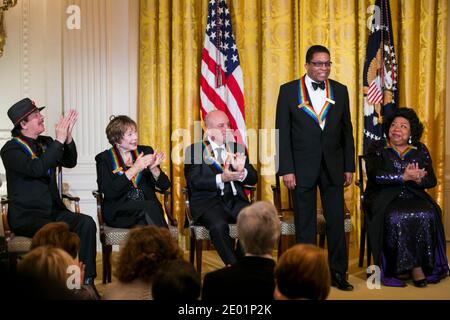 2013 Kennedy Center Honorees (L-R) Carlos Santana, Shirley MacLaine, Billy Joel, Herbie Hancock and Martina Arroyo attend a reception at the White House prior to the Kennedy Center ceremony on December 8, 2013 in Washington, DC. Photo Credit: Kristoffer Tripplaar/ Sipa Press Stock Photo