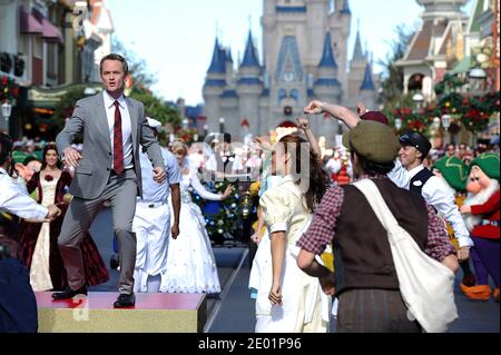 Emmy Award-winning actor Neil Patrick Harris tapes a musical number for the Cast members from Disney's Broadway musical 'Newsies' tape a musical number for the Disney Parks Christmas Day Parade TV special at the Magic Kingdom park at Walt Disney World Resort in Lake Buena Vista, FL, USA on December 07, 2013. In addition to performing, Harris is one of the hosts of the annual holiday special. The 30th annual holiday telecast airs December 25 on ABC-TV. The show also will air in Canada on CBC Network, and across the globe on the American Forces Network. Photo by Mark Ashman/Disney Handout/ABACAP Stock Photo