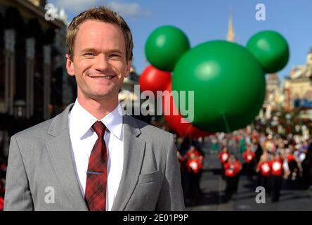 Emmy Award-winning actor Neil Patrick Harris tapes a musical number for the Cast members from Disney's Broadway musical 'Newsies' tape a musical number for the Disney Parks Christmas Day Parade TV special at the Magic Kingdom park at Walt Disney World Resort in Lake Buena Vista, FL, USA on December 07, 2013. In addition to performing, Harris is one of the hosts of the annual holiday special. The 30th annual holiday telecast airs December 25 on ABC-TV. The show also will air in Canada on CBC Network, and across the globe on the American Forces Network. Photo by Mark Ashman/Disney Handout/ABACAP Stock Photo