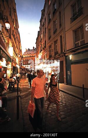 FRANCE / IIe-de-France/Paris/ Coupel walking in Latin Quarter at night . Stock Photo