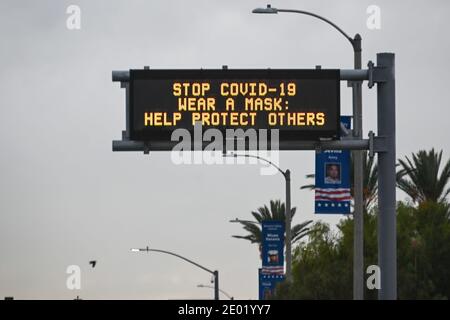 A Caltrans message board is seen with the words “Stop COVID-19 Wear A Mask : Help Protect Others” amid the global coronavirus pandemic on Thursday, De Stock Photo