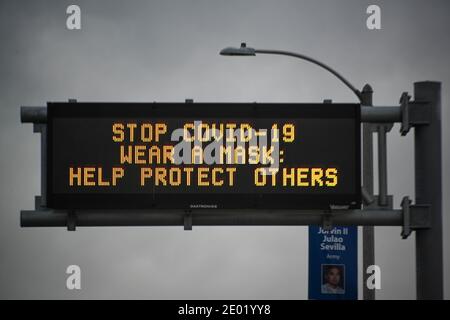 A Caltrans message board is seen with the words “Stop COVID-19 Wear A Mask : Help Protect Others” amid the global coronavirus pandemic on Thursday, De Stock Photo
