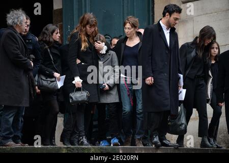 Please hide the children's faces prior to the publication Lou Doillon, son Marlowe, Jane Birkin and Charlotte Gainsbourg with her daughter Alice attending a tribute mass for Kate Barry held at Saint Roch church in Paris, France on December 19, 2013. Photographer Kate Barry, the daughter of Jane Birkin and John Barry has been found dead on December 11 after falling from the window of her apartment in Paris. She was 46. Photo by ABACAPRESS.COM Stock Photo