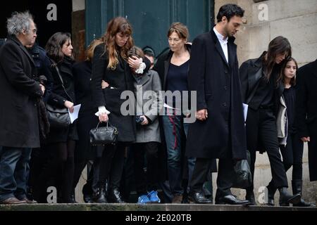 Please hide the children's faces prior to the publication Lou Doillon and her son Marlowe, Jane Birkin and Charlotte Gainsbourg and her daughter Alice attending a tribute mass for Kate Barry held at Saint Roch church in Paris, France on December 19, 2013. Photographer Kate Barry, the daughter of Jane Birkin and John Barry has been found dead on December 11 after falling from the window of her apartment in Paris. She was 46. Photo by ABACAPRESS.COM Stock Photo