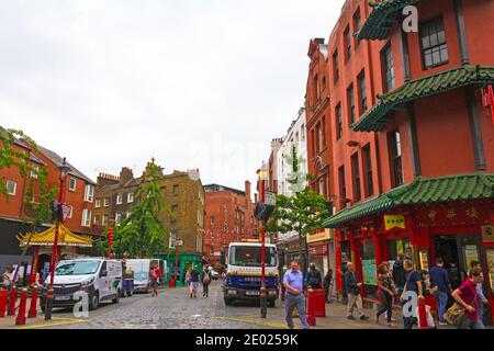 View of Chinatown-Colourful area with dozens of Chinese eateries, shops & ornate landmarks such as Chinatown Gate.London,United Kingdom,August 2016 Stock Photo