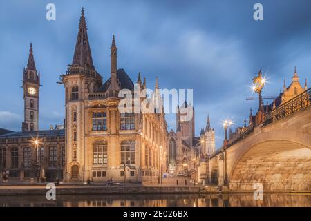 Ghent, Belgium - November 13 2014: The beautiful historic old town of Ghent, Belgium along the Leie Canal at dusk. Stock Photo