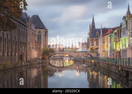 Ghent, Belgium - November 13 2014: The beautiful historic old town of Ghent, Belgium along the Leie Canal at dusk. Stock Photo