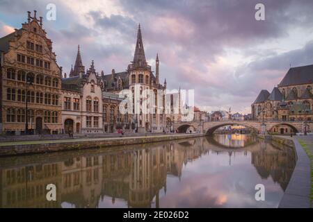 Ghent, Belgium - November 13 2014: The beautiful historic old town of Ghent, Belgium along the Leie Canal at sunset Stock Photo