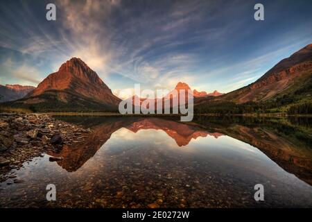 Sunrise in Many Glacier at Swiftcurrent Lake Stock Photo