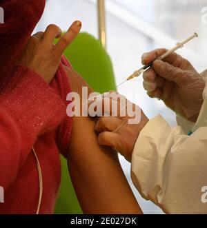Rome, Italy. 28th Dec, 2020. A woman receives an injection of the COVID-19 vaccine at the San Filippo Neri Hospital in Rome, Italy, Dec. 28, 2020. Credit: Alberto Lingria/Xinhua/Alamy Live News Stock Photo